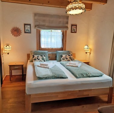 Schlafzimmer Ferienhaus Breitner Chalet Wasserfallblick